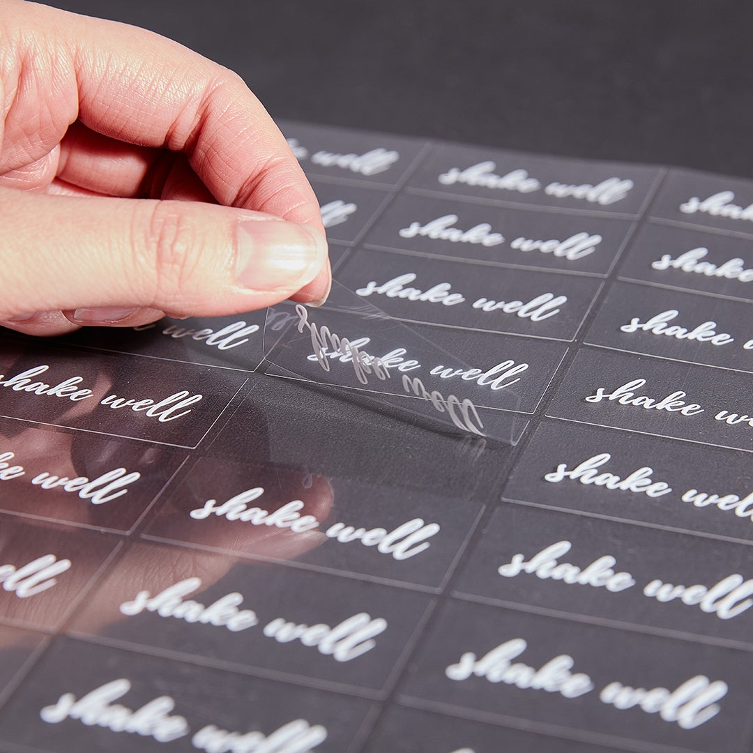 Labels, Shake Well, 2 x 1 Inch, Water Resistant, Clear with White Font,1 - 100 COUNT